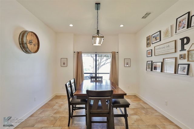 dining area with light tile patterned floors