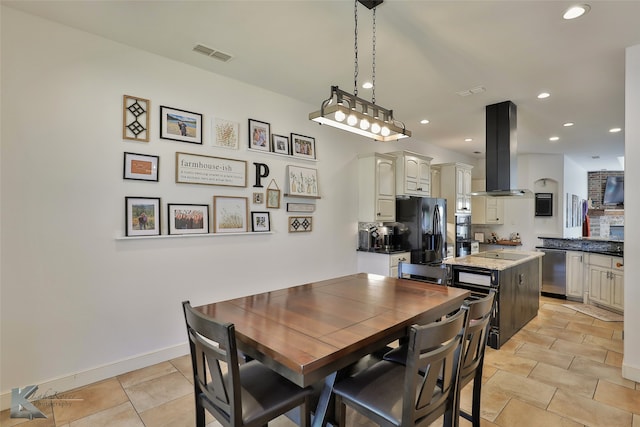 dining area with light tile patterned flooring