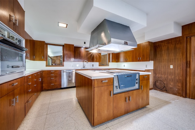 kitchen featuring stainless steel dishwasher, black oven, sink, island exhaust hood, and a kitchen island