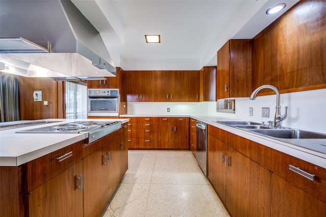 kitchen with appliances with stainless steel finishes, sink, and island range hood