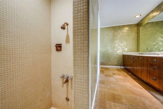 bathroom featuring a shower and vanity