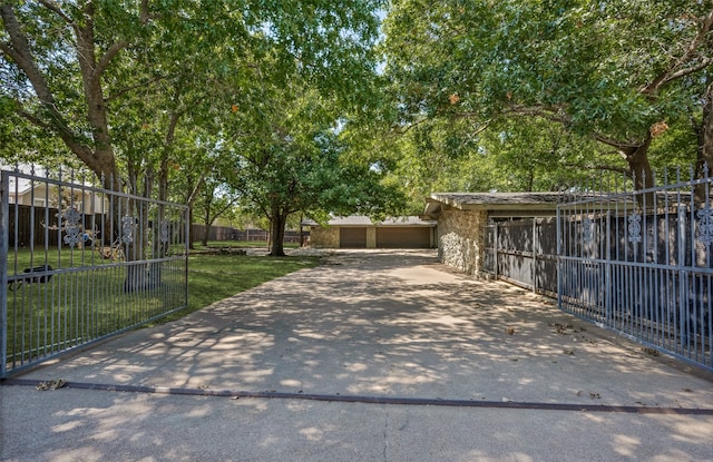 view of gate featuring a lawn