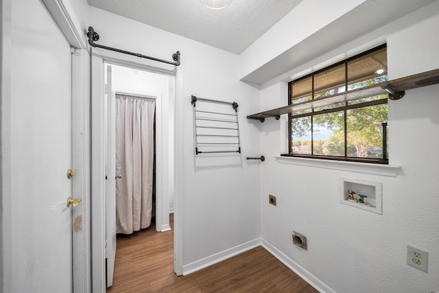 clothes washing area with washer hookup, dark hardwood / wood-style floors, and electric dryer hookup