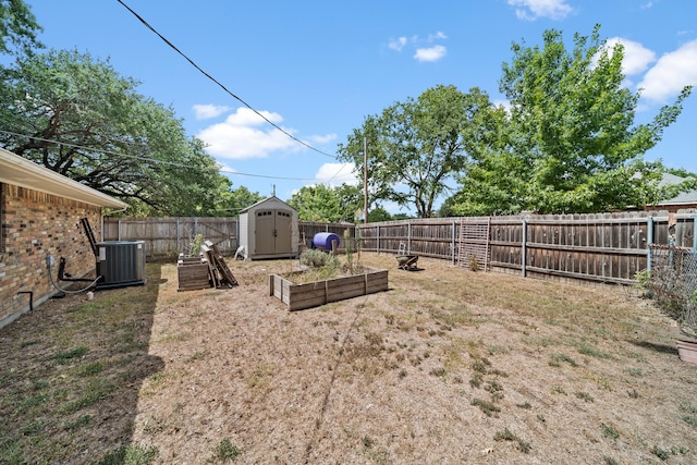 view of yard with central AC and a shed