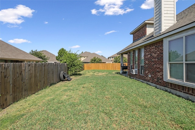 view of yard featuring cooling unit and a fenced backyard