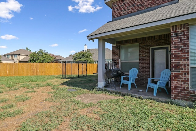 view of yard with a patio and fence