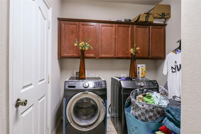 laundry room with washer and dryer and cabinet space