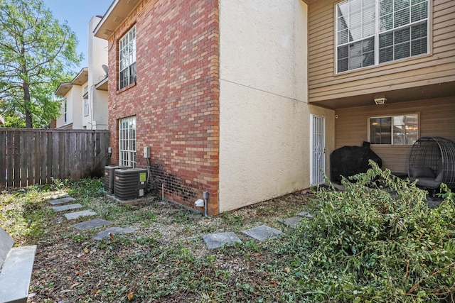 view of home's exterior with cooling unit