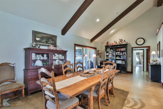 dining space with high vaulted ceiling and beamed ceiling