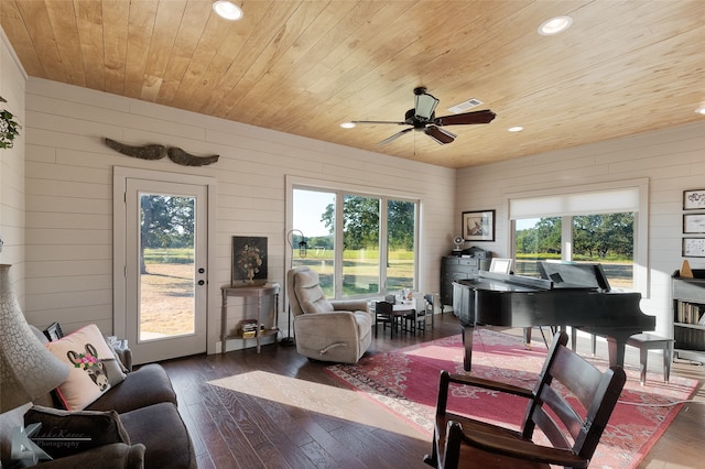 sunroom / solarium featuring wood ceiling, ceiling fan, and a wealth of natural light