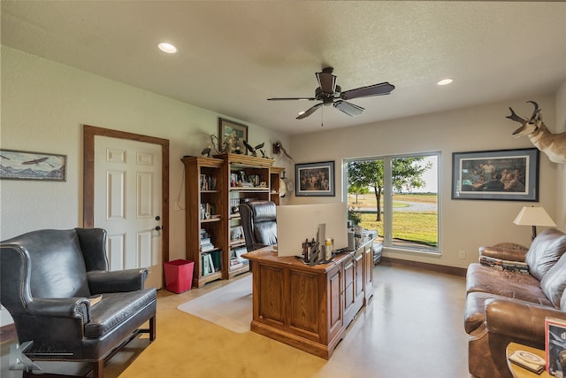 office featuring a textured ceiling and ceiling fan