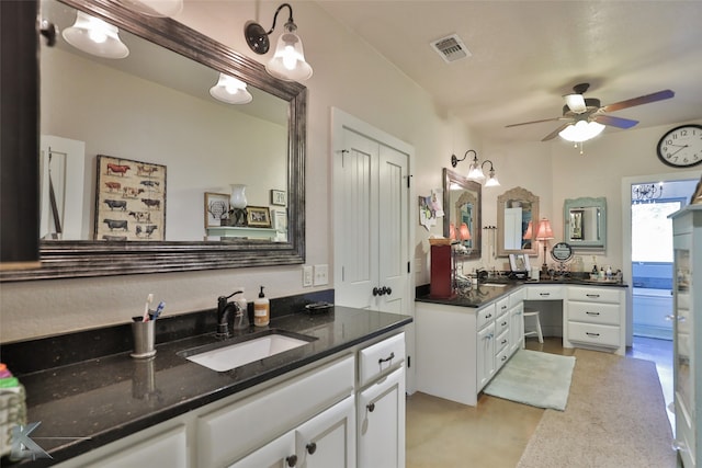 bathroom featuring ceiling fan and vanity