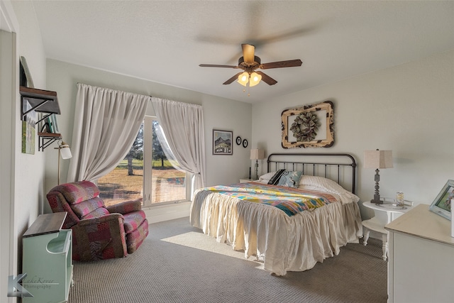 bedroom featuring ceiling fan and light carpet