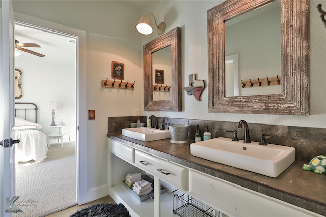 bathroom with ceiling fan and vanity