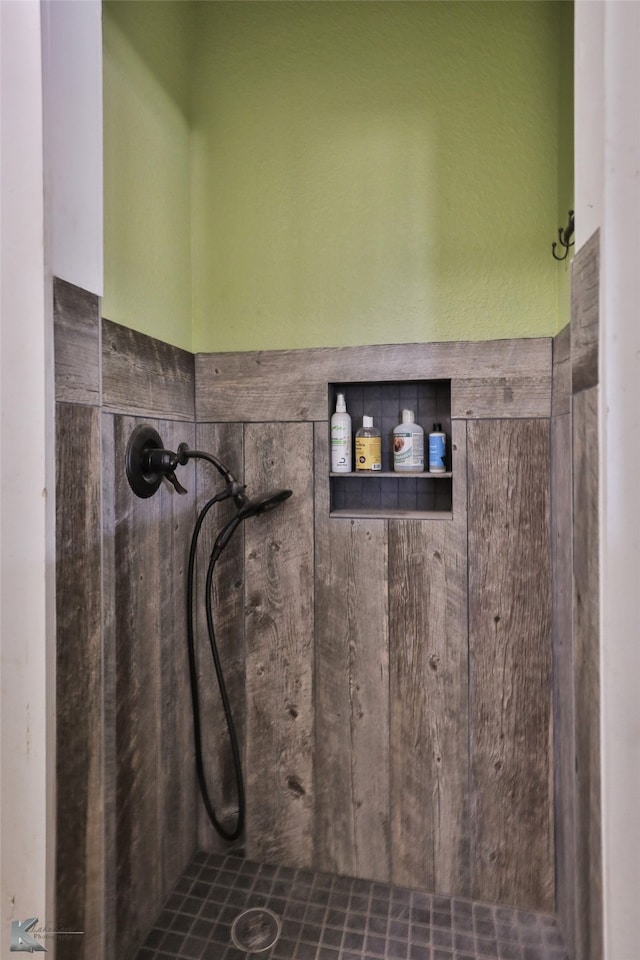 bathroom with a tile shower