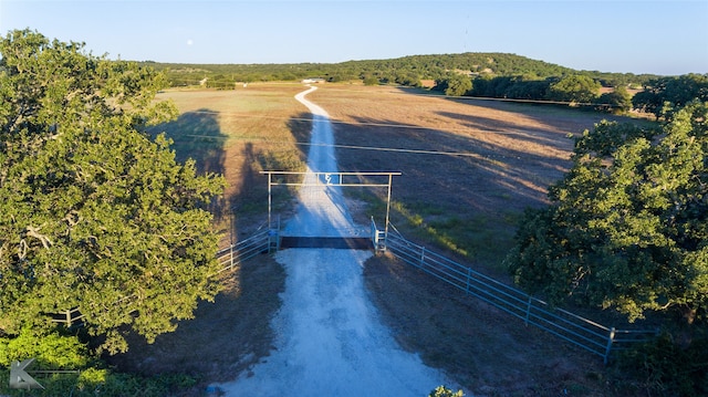 birds eye view of property with a rural view