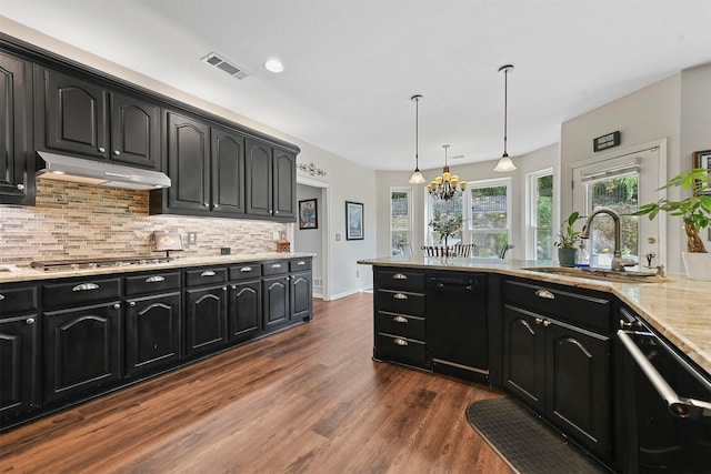 kitchen with stainless steel gas cooktop, sink, decorative light fixtures, dishwasher, and dark hardwood / wood-style floors