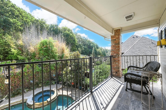 balcony with an in ground hot tub