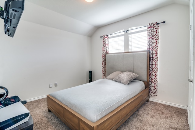 bedroom featuring carpet flooring and lofted ceiling