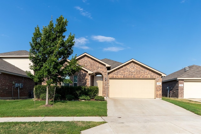 ranch-style house with an attached garage, driveway, a front lawn, and brick siding