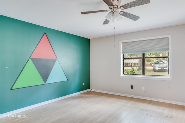 unfurnished room featuring light wood-type flooring and ceiling fan