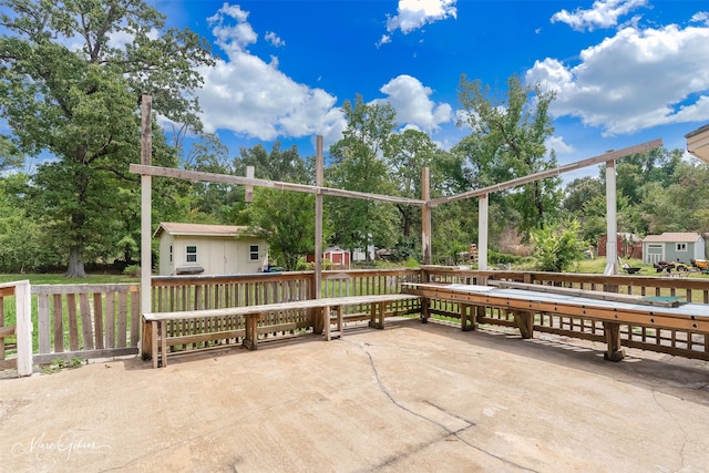 view of patio / terrace with a storage shed