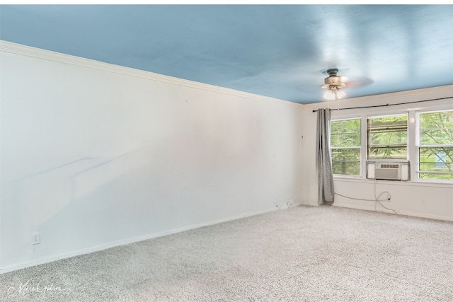 empty room featuring ornamental molding, cooling unit, carpet flooring, and ceiling fan