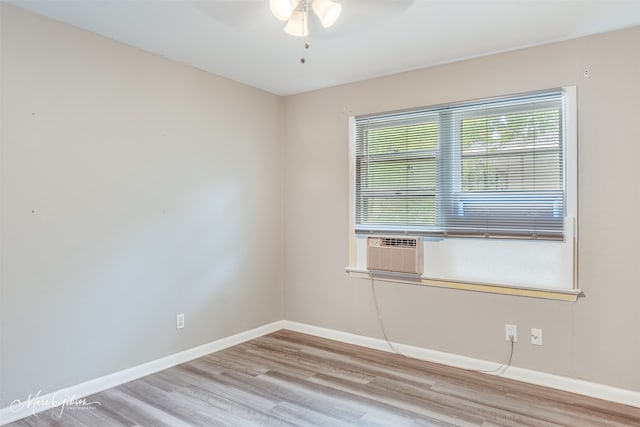 spare room featuring light hardwood / wood-style floors and ceiling fan