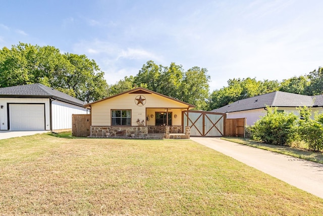 view of front of property with a front lawn, a porch, and a garage