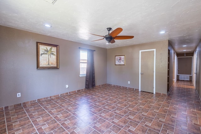 unfurnished room featuring ceiling fan