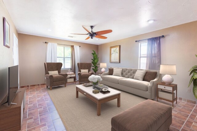 living room featuring ceiling fan and tile patterned flooring