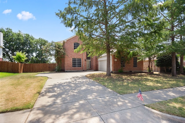 view of front of home featuring a garage and a front yard