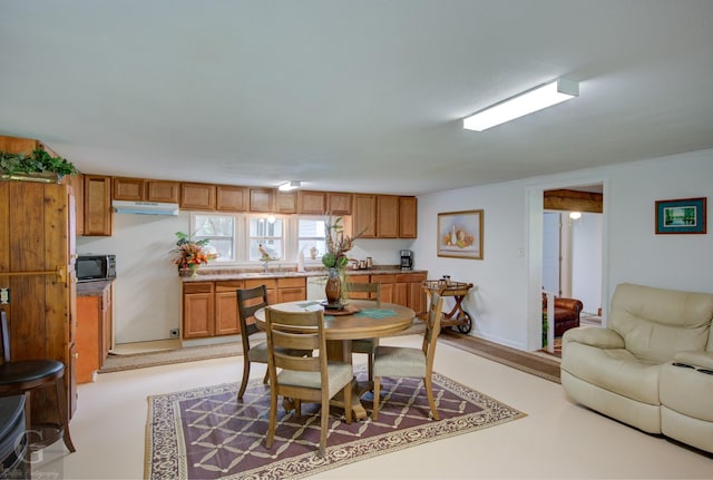 dining room featuring baseboards