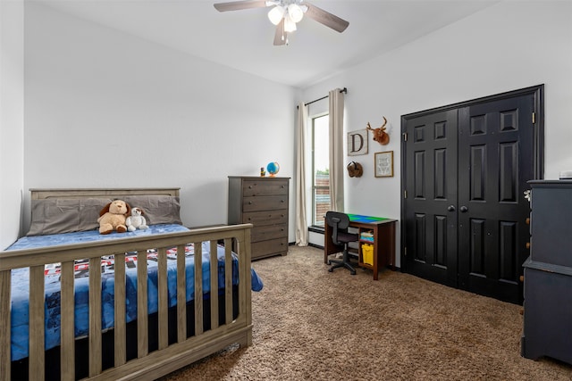 carpeted bedroom featuring a closet and ceiling fan