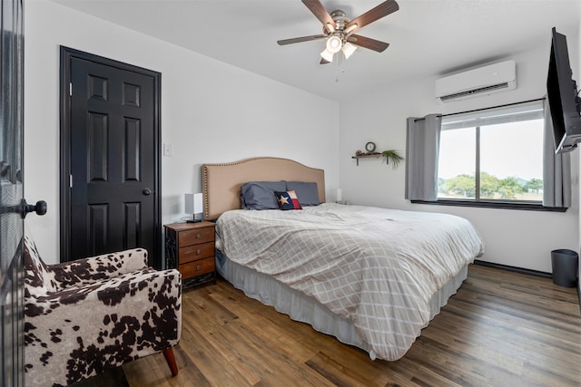 bedroom featuring a wall mounted AC, ceiling fan, and dark hardwood / wood-style floors