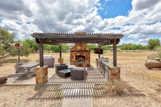 view of patio featuring an outdoor stone fireplace and a pergola