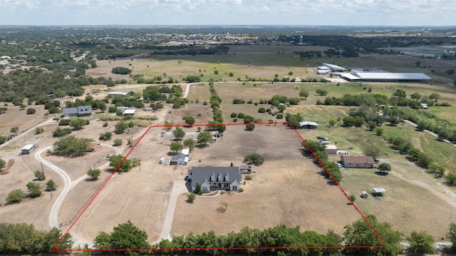 birds eye view of property featuring a rural view