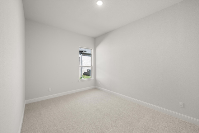 unfurnished room featuring carpet