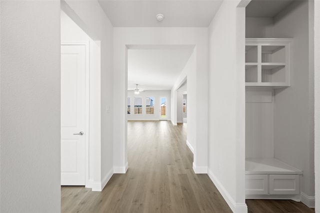 hallway with light hardwood / wood-style floors