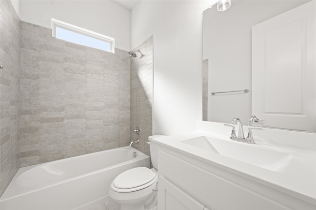 full bathroom featuring vanity, toilet, and tiled shower / bath combo