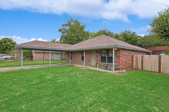 ranch-style house with a carport and a front lawn