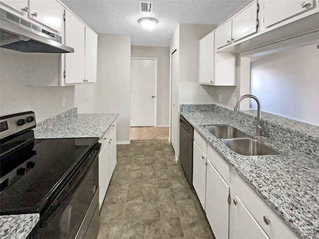 kitchen featuring white cabinets, tile patterned floors, sink, a textured ceiling, and stainless steel appliances