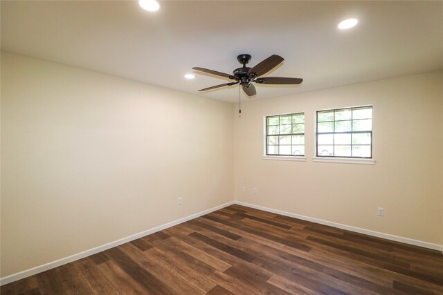 empty room featuring recessed lighting, dark wood-style flooring, ceiling fan, and baseboards