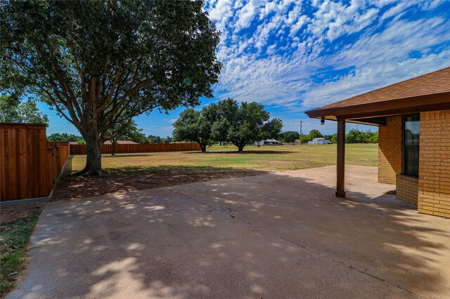 view of patio featuring fence