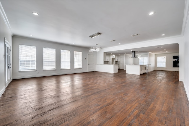 unfurnished living room with crown molding and dark wood-type flooring