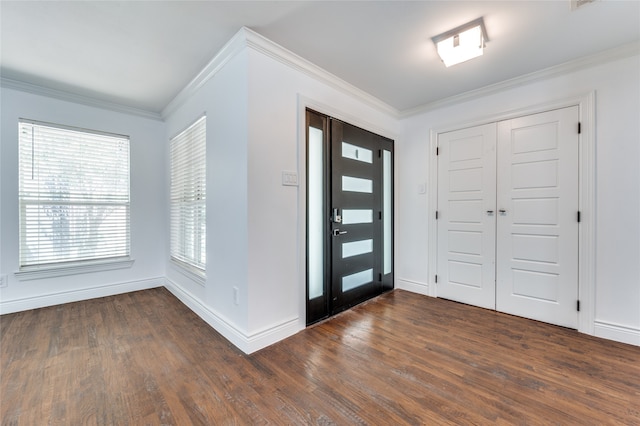 entrance foyer featuring hardwood / wood-style floors and ornamental molding