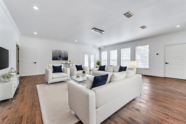 living room featuring dark hardwood / wood-style floors and ornamental molding