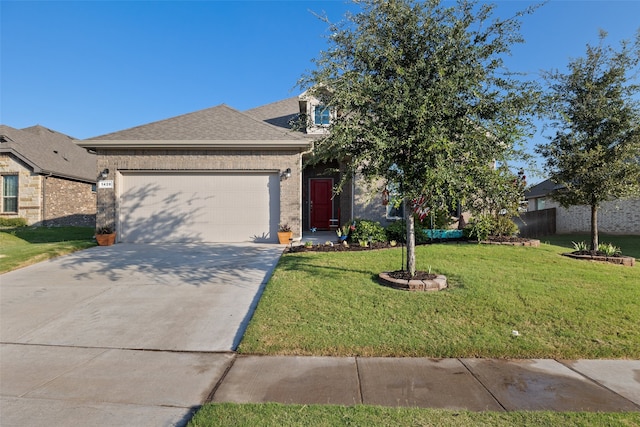 view of front facade featuring a garage and a front yard