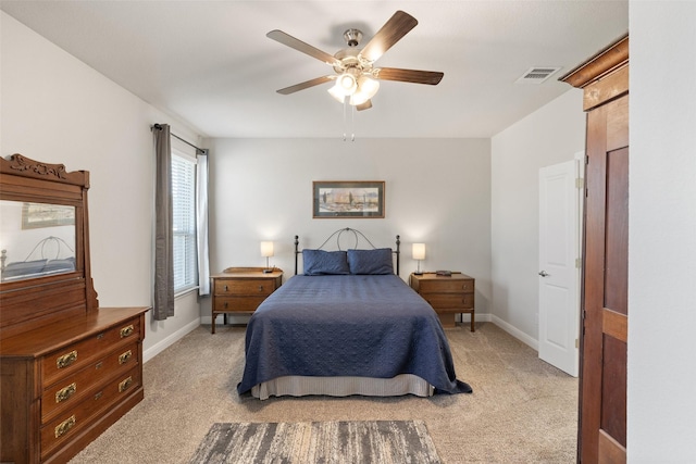 bedroom featuring ceiling fan and light carpet