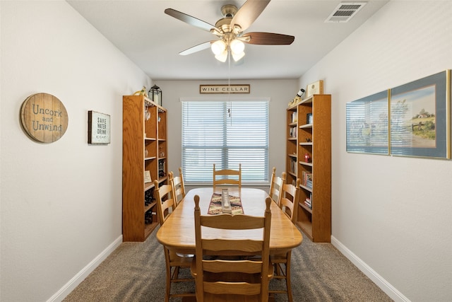 dining room with ceiling fan and carpet floors